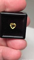 Heart-cut champagne chrysoberyl in black display case