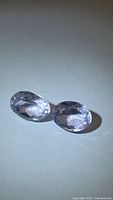 Pair of oval faceted amethysts top view