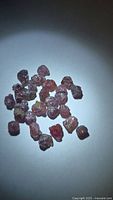 Group of rough multicolored sapphire crystals on white background