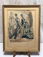 Full view of framed fashion lithograph showing image, mat and frame