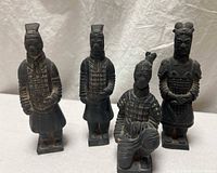 Front view of all four terracotta warrior figurines
