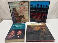 All four books front covers visible