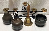 All five metal decor items grouped together