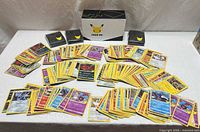 Overall lot showing cards spread out, Train On box and sleeve packs
