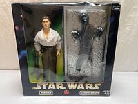 Front of sealed box showing figure and Carbonite block