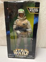 Front of sealed box showing 12" figure and accessories