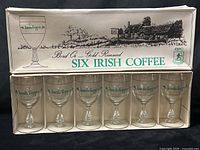 Front view of boxed set showing six glasses in original display carton