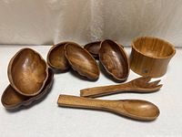 group view of large bowl, six small bowls, spoon, fork