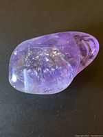Full view of polished amethyst nugget