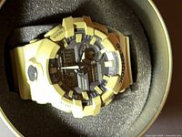 Top view of beige Casio G-Shock watch in case