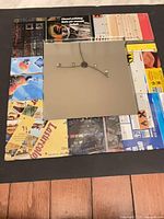 Front view showing full mirror and patchwork metal advertising frame