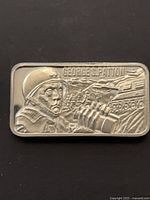Obverse of silver bar showing Patton relief and title text