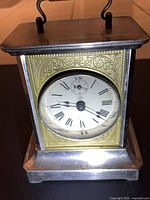 Front view of Junghans clock showing case and dial