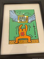 Front view of framed Keith Haring pop art print