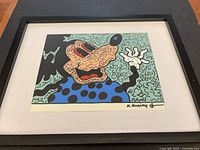 Full view of framed K. Haring print