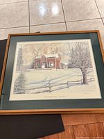 Full view of framed signed print with mat