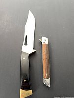 Both knives opened showing full blades and handles