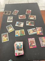 overhead view of scattered trading cards showing multiple themes
