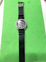 Full view of Seiko Air Diver 200m watch on green background