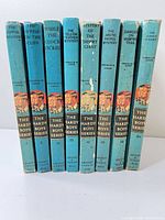 Spines of all eight Hardy Boys books showing titles and numbers
