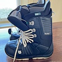 Left and right Burton Casa boots side view showing logo, stitching, laces and overall condition