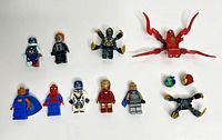 Front view of all minifigures and accessories laid out on white background