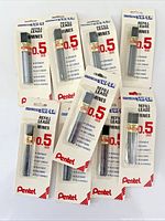Front view of nine blister-pack tubes showing Pentel branding and 0.5 mm specification