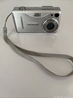 Front view of Nikon Coolpix E3700 with wrist strap