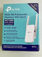 Front of sealed TP-Link RE315 AC1200 extender box