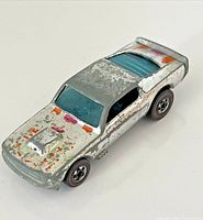 Left-front view of chrome Mustang Stocker showing graphics and redline wheels