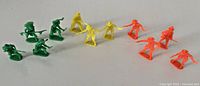 All eleven plastic figures grouped by color