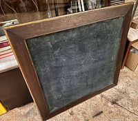 Front view of table showing green felt playing surface and wood frame