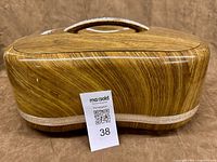 closed lunch box showing wood-grain exterior
