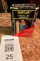 Front view of Hustler Collector Set Series II box on marble surface