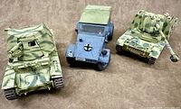 Three assembled 1:35-scale German vehicles: Nashorn, Kubelwagen, Wespe
