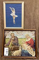 Both framed needlepoints together: ballerina (top) and Holy Family (bottom)