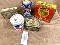 Group shot of five advertising tins