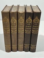 Spines of all five volumes showing titles, series numbers and condition