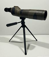 Side view of Bushnell Sentry spotting scope mounted on tripod
