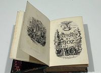 Illustrated title page and marbled board edges visible