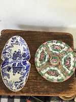 Top view of both porcelain pieces showing decorations.