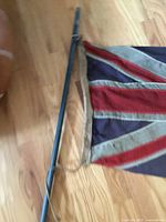 Close view of flag and pole attachment area