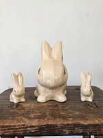Front view of all three ceramic bunnies