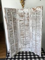 Full view of trifold shutters standing