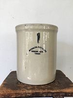 Front view showing Medalta Potteries stencil and capacity mark