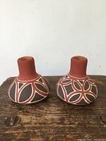 Front view of both vases showing shape and painted design