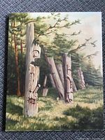 Full view of unframed oil painting showing totem poles and forest scene