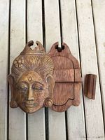 Puzzle box partially opened showing removable components