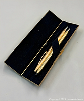 Open Sheaffer case with two gold-filled Cross instruments
