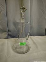 Full view of decanter showing stopper, handle, base